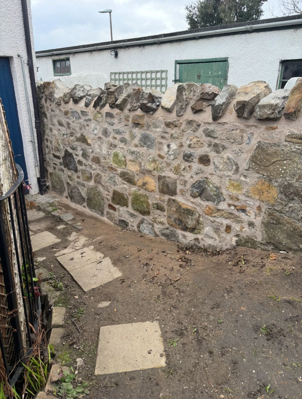 Random rubble style - Built with clients existing Sandstone and igneous rock using lime mortar