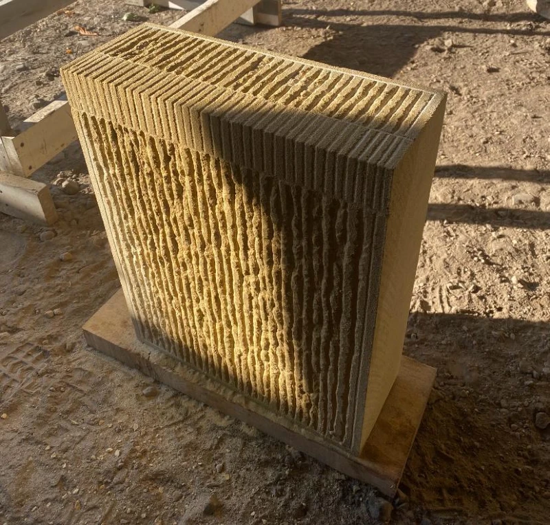 A quoin stone with a droving margin and a broached face